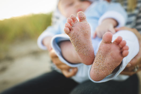 Kalispell-ObGyn---LARC / baby with sandy feet