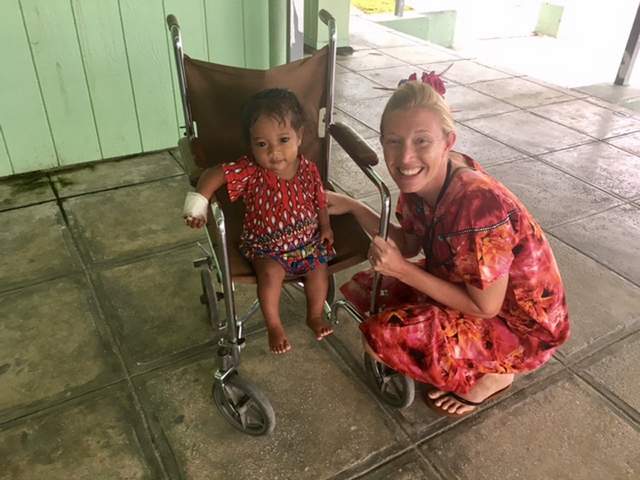 Kasey Patton with child at the hospital in Majuro