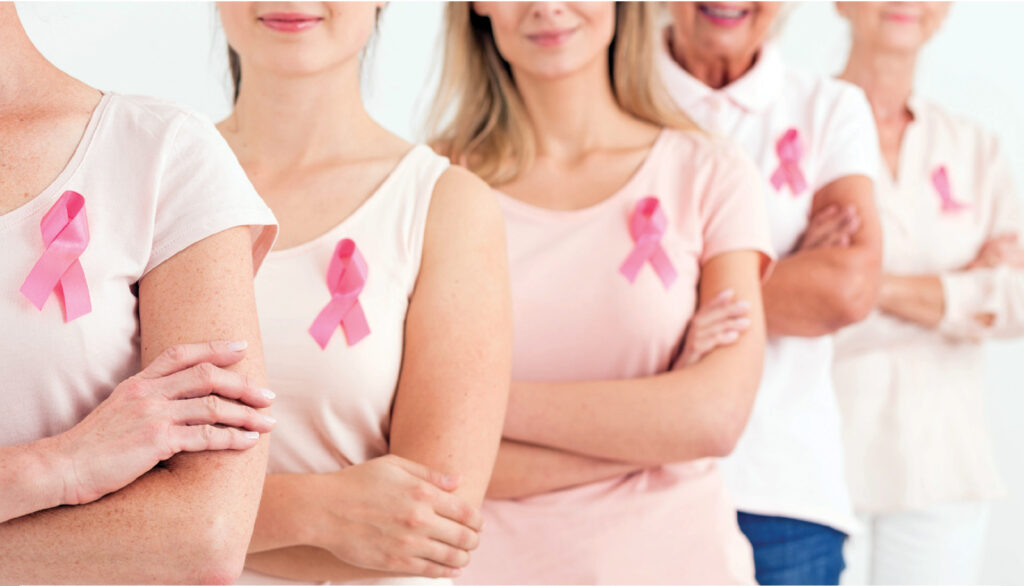 women wearing pink ribbons for breast cancer awareness